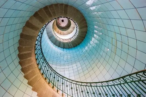 Worm's-eye view of a blue spiral staircase