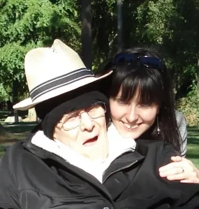 Beth and Dad outside in a park