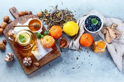 Selection of natural herbs and cold remedies on white background
