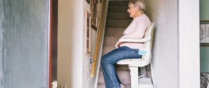 Older woman sitting on a chair lift