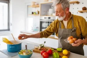 Old man cooking