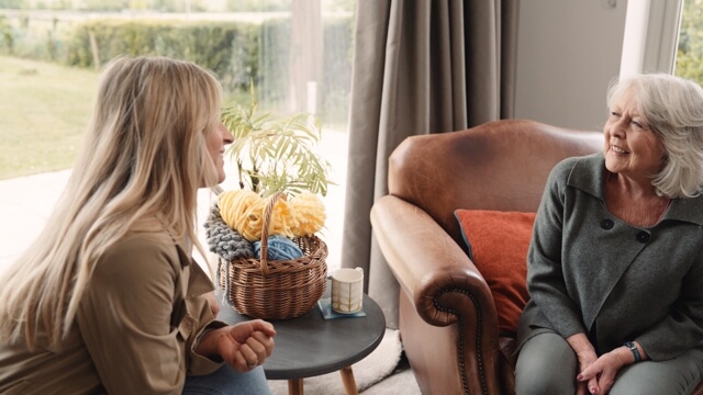 Unpaid carer chatting with mum